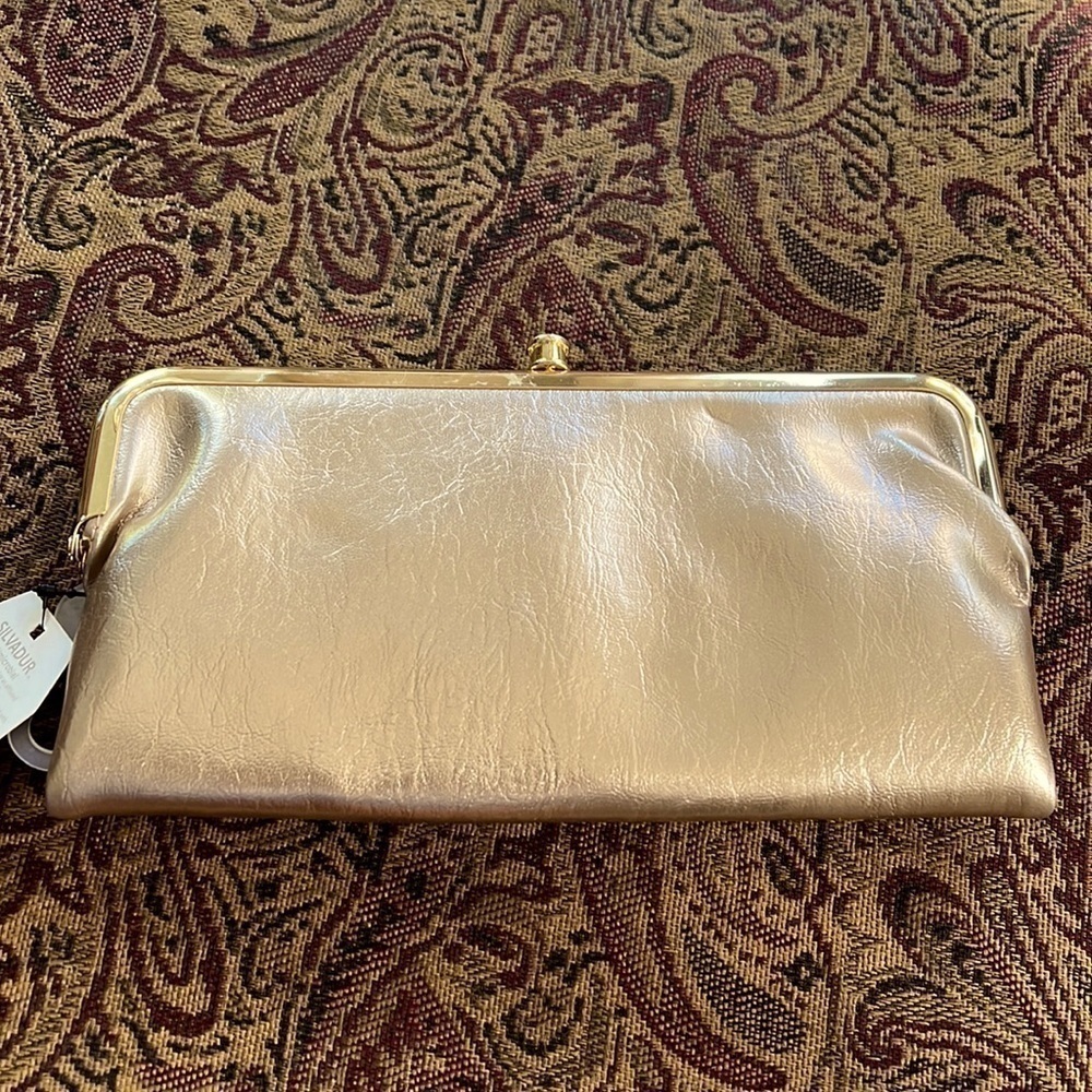 Light gold clutch that is actually functional, lots of space, new